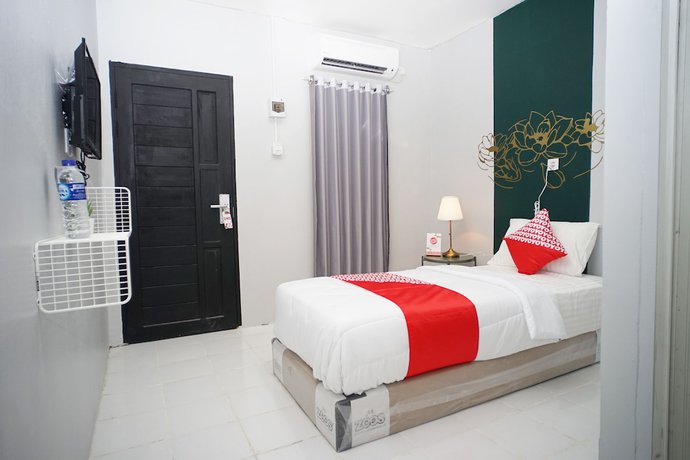 Imagen de la habitación del Hotel OYO 1125 Sani Guest House. Foto 12