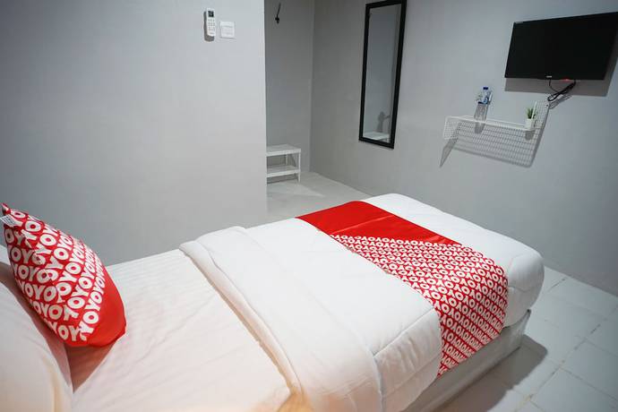 Imagen de la habitación del Hotel OYO 1125 Sani Guest House. Foto 13