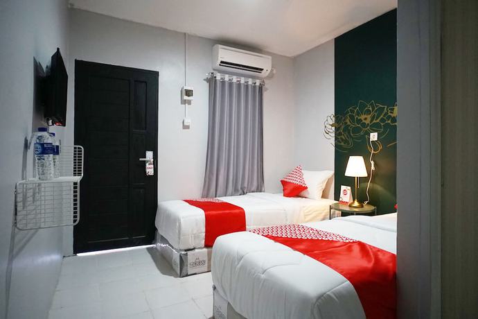 Imagen de la habitación del Hotel OYO 1125 Sani Guest House. Foto 14