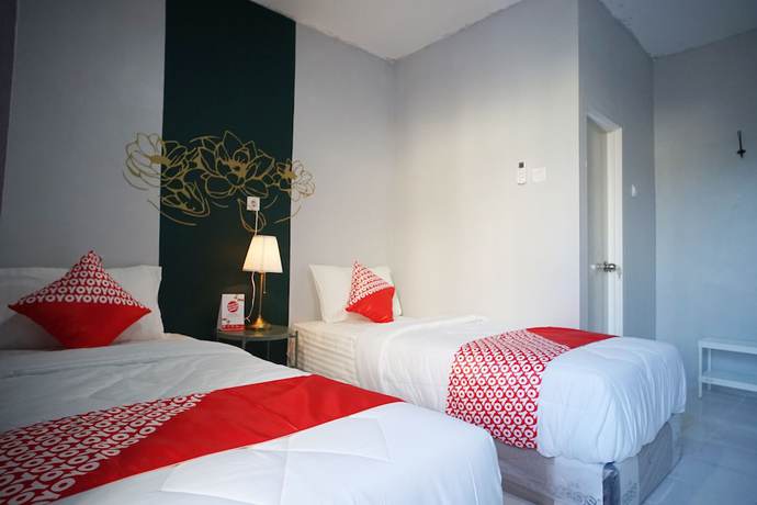 Imagen de la habitación del Hotel OYO 1125 Sani Guest House. Foto 15