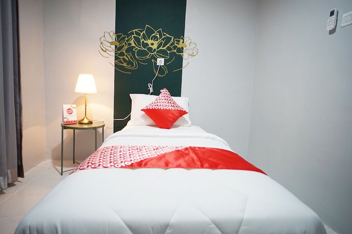 Imagen de la habitación del Hotel OYO 1125 Sani Guest House. Foto 16