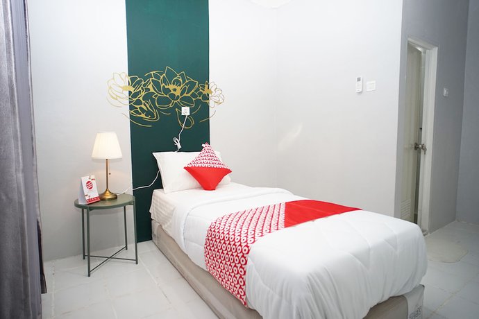 Imagen de la habitación del Hotel OYO 1125 Sani Guest House. Foto 18
