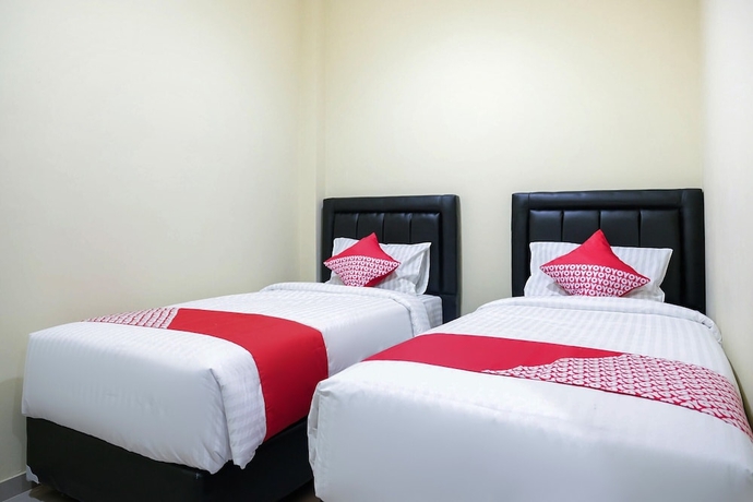 Imagen de la habitación del Hotel OYO 1149 Mustika. Foto 2