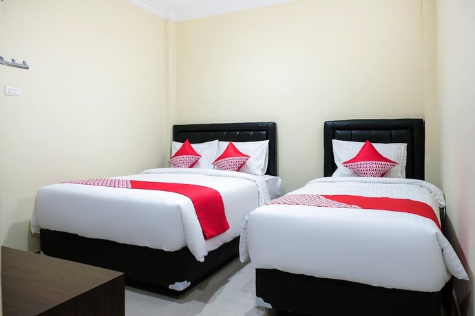 Imagen de la habitación del Hotel OYO 1149 Mustika. Foto 4