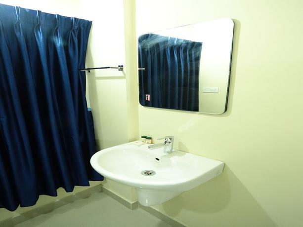 Imagen de la habitación del Hotel OYO 11909 Star Plaza. Foto 11