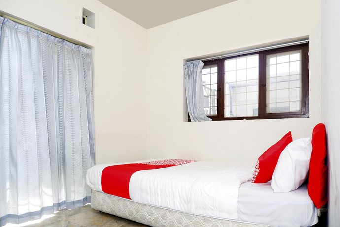 Imagen de la habitación del Hotel OYO 1196 Pura Puspa Rosa. Foto 12