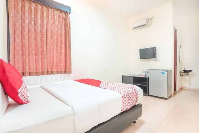 Imagen de la habitación del Hotel OYO 122 Oekude Kost. Foto 6