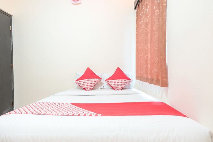 Imagen de la habitación del Hotel OYO 122 Oekude Kost. Foto 12