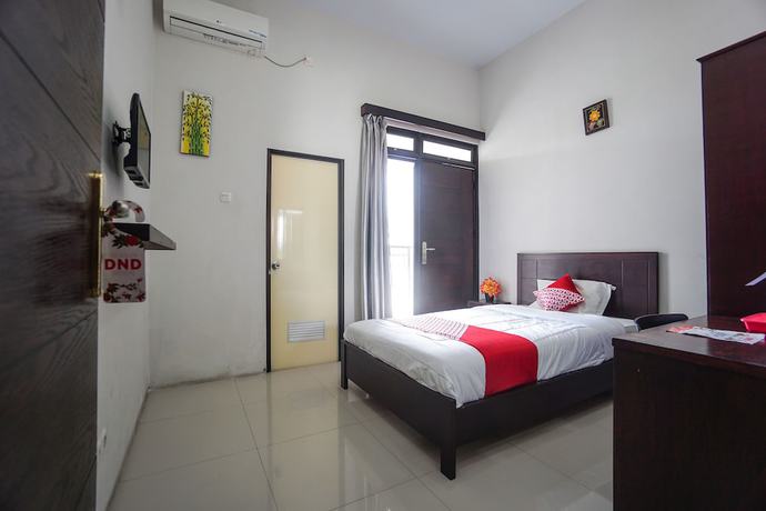 Imagen de la habitación del Hotel OYO 1236 Elite Residence. Foto 4