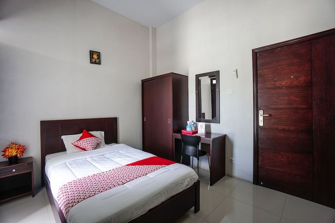 Imagen de la habitación del Hotel OYO 1236 Elite Residence. Foto 7