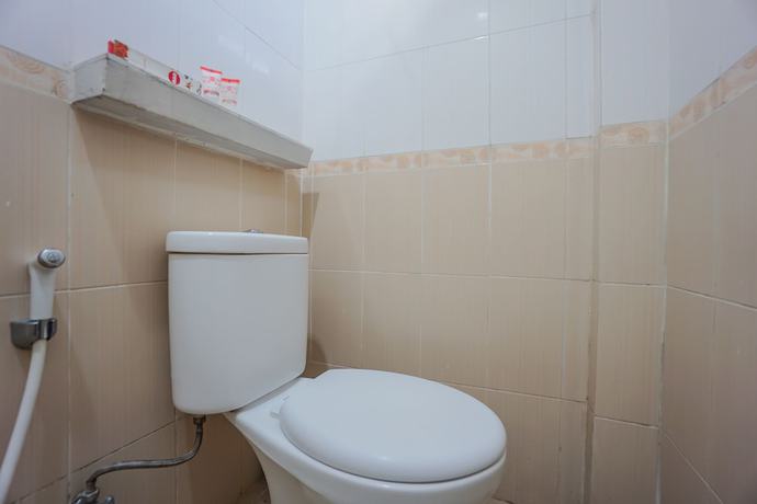 Imagen de la habitación del Hotel OYO 1236 Elite Residence. Foto 13