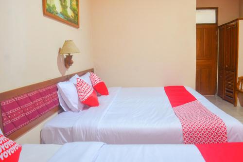 Imagen de la habitación del Hotel OYO 1240 Pantai Jaya. Foto 4