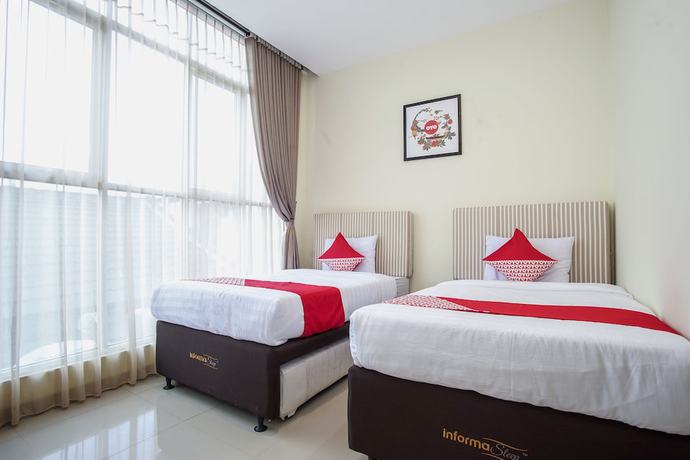 Imagen de la habitación del Hotel OYO 1241 Eirini Family Homestay. Foto 3