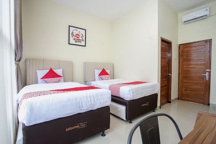 Imagen de la habitación del Hotel OYO 1241 Eirini Family Homestay. Foto 7