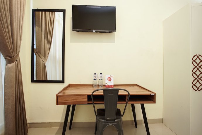 Imagen de la habitación del Hotel OYO 1241 Eirini Family Homestay. Foto 8