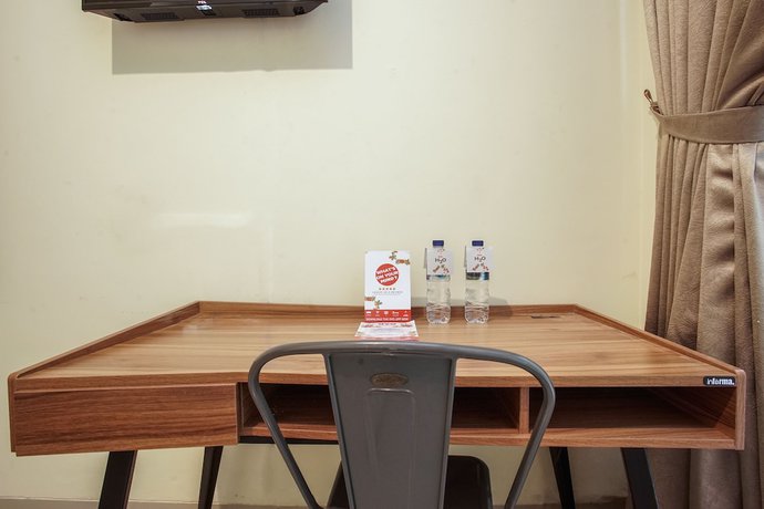 Imagen de la habitación del Hotel OYO 1241 Eirini Family Homestay. Foto 13