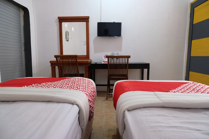 Imagen de la habitación del Hotel OYO 1278 Wina Beach. Foto 5