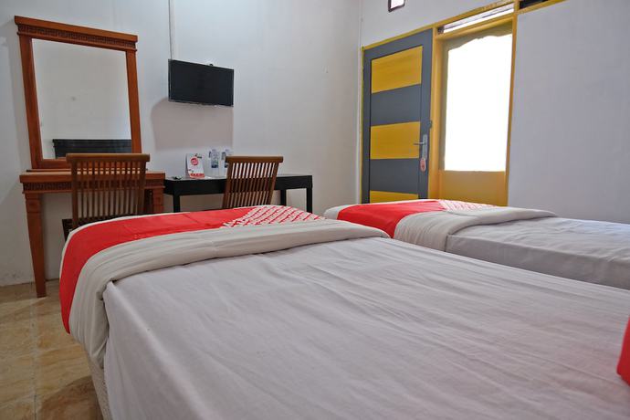 Imagen de la habitación del Hotel OYO 1278 Wina Beach. Foto 7