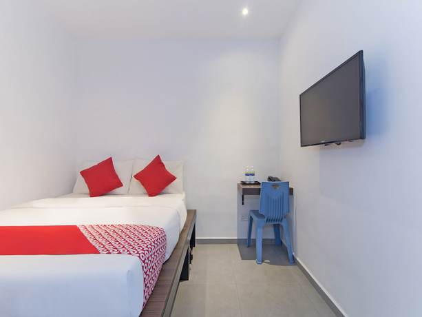 Imagen de la habitación del Hotel OYO 128 Mutiara Suites. Foto 5