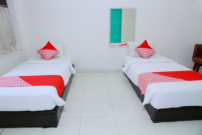 Imagen de la habitación del Hotel OYO 1325 Grand Wisata. Foto 9