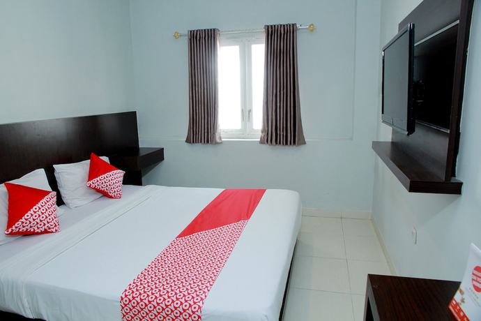 Imagen de la habitación del Hotel OYO 1325 Grand Wisata. Foto 11