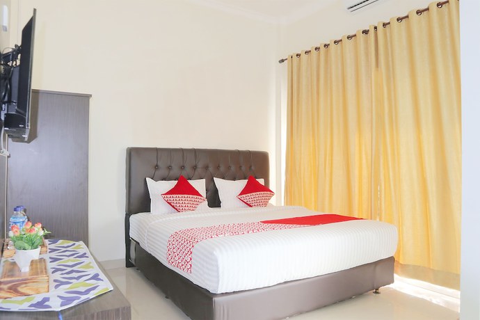 Imagen de la habitación del Hotel OYO 1326 Mahakam Guest House. Foto 4