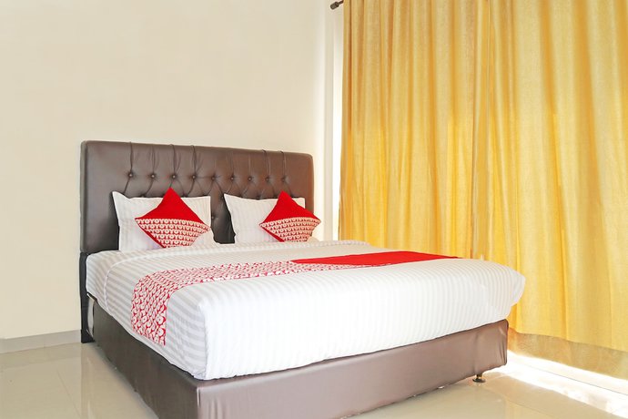 Imagen de la habitación del Hotel OYO 1326 Mahakam Guest House. Foto 9