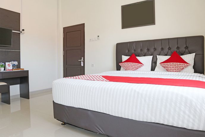 Imagen de la habitación del Hotel OYO 1326 Mahakam Guest House. Foto 10