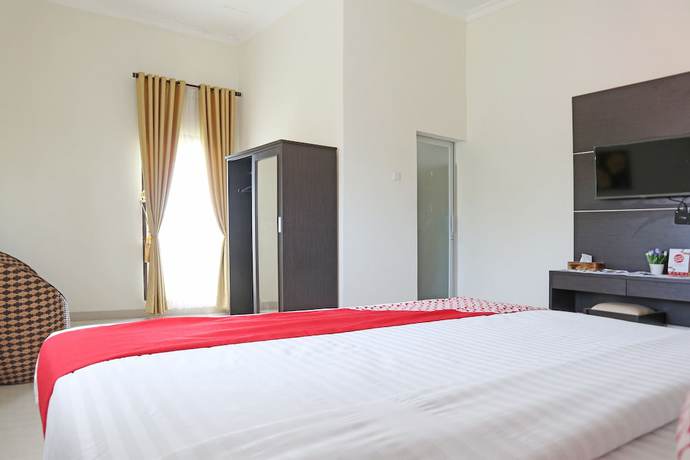 Imagen de la habitación del Hotel OYO 1326 Mahakam Guest House. Foto 11