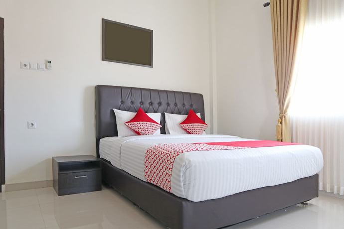 Imagen de la habitación del Hotel OYO 1326 Mahakam Guest House. Foto 12