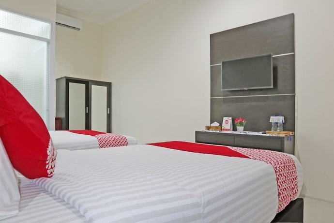 Imagen de la habitación del Hotel OYO 1326 Mahakam Guest House. Foto 13