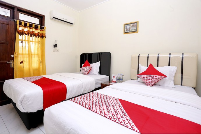 Imagen de la habitación del Hotel OYO 1366 Kayoman Family Homestay. Foto 2