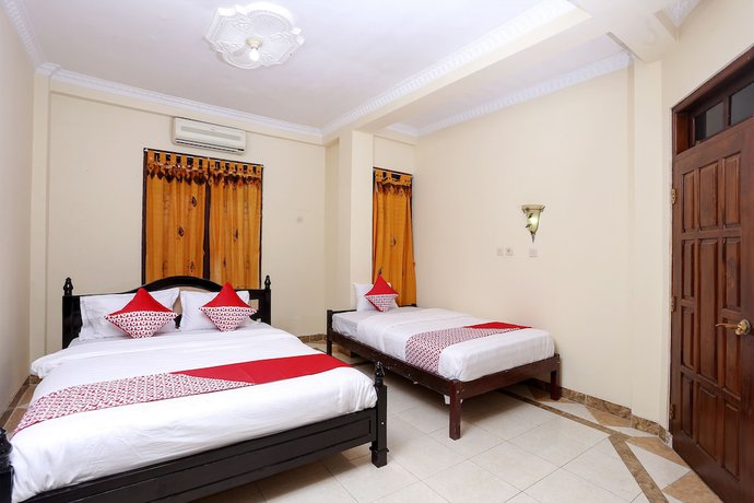 Imagen de la habitación del Hotel OYO 1366 Kayoman Family Homestay. Foto 3