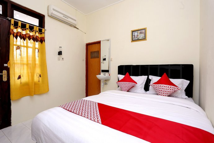 Imagen de la habitación del Hotel OYO 1366 Kayoman Family Homestay. Foto 5