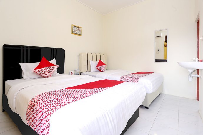Imagen de la habitación del Hotel OYO 1366 Kayoman Family Homestay. Foto 6