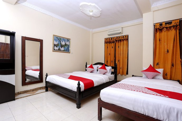 Imagen de la habitación del Hotel OYO 1366 Kayoman Family Homestay. Foto 8