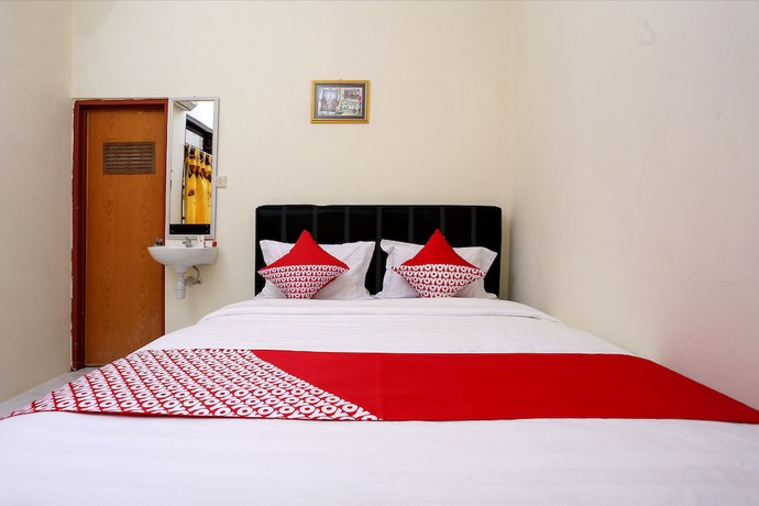 Imagen de la habitación del Hotel OYO 1366 Kayoman Family Homestay. Foto 10