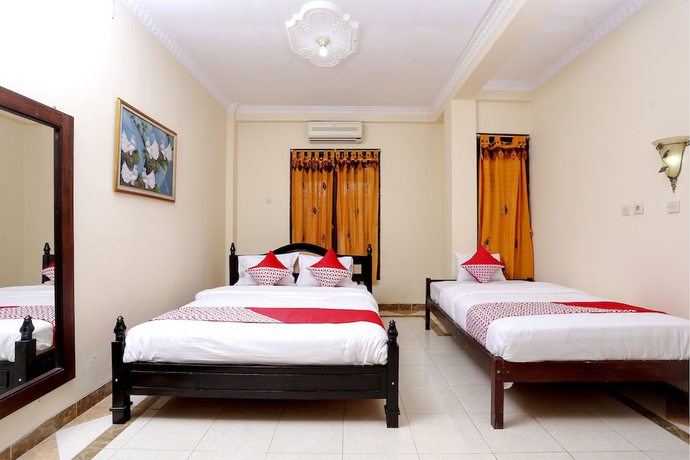 Imagen de la habitación del Hotel OYO 1366 Kayoman Family Homestay. Foto 12