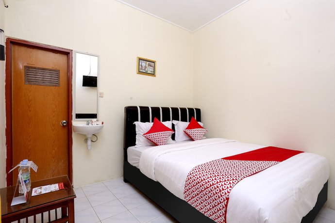 Imagen de la habitación del Hotel OYO 1366 Kayoman Family Homestay. Foto 13