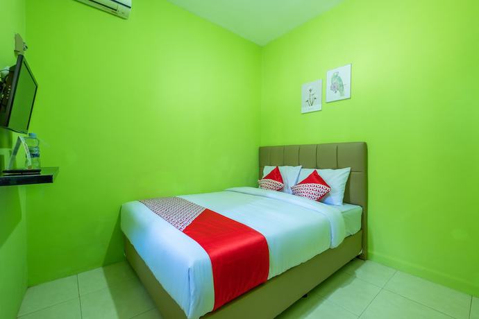 Imagen de la habitación del Hotel OYO 1399 Cemara Residence Syariah. Foto 2
