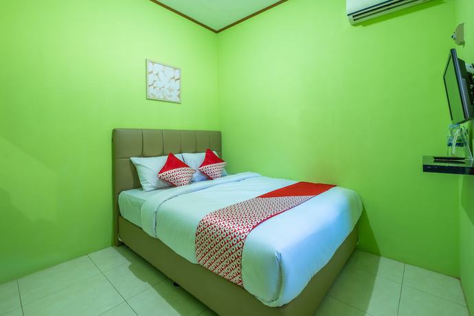 Imagen de la habitación del Hotel OYO 1399 Cemara Residence Syariah. Foto 9