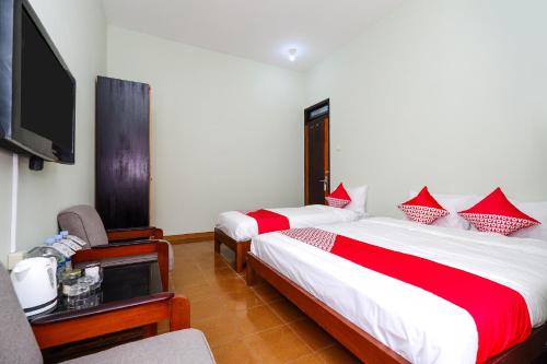 Imagen de la habitación del Hotel OYO 1414 Paviliun Permata. Foto 20