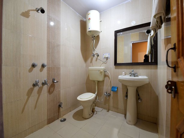 Imagen de la habitación del Hotel OYO 14218 Elixir Cottage. Foto 6