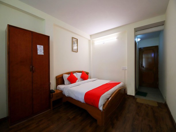 Imagen de la habitación del Hotel OYO 14218 Elixir Cottage. Foto 10