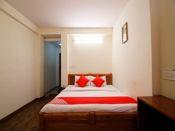 Imagen de la habitación del Hotel OYO 14218 Elixir Cottage. Foto 12