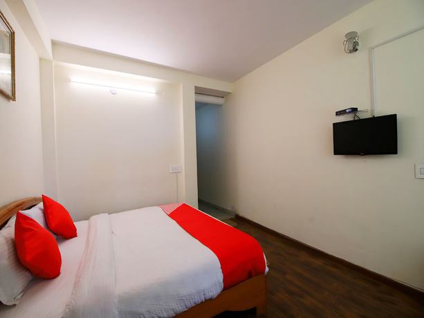 Imagen de la habitación del Hotel OYO 14218 Elixir Cottage. Foto 16