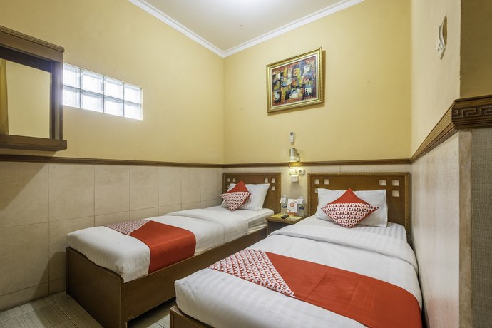 Imagen de la habitación del Hotel OYO 1446 Patradisa. Foto 6