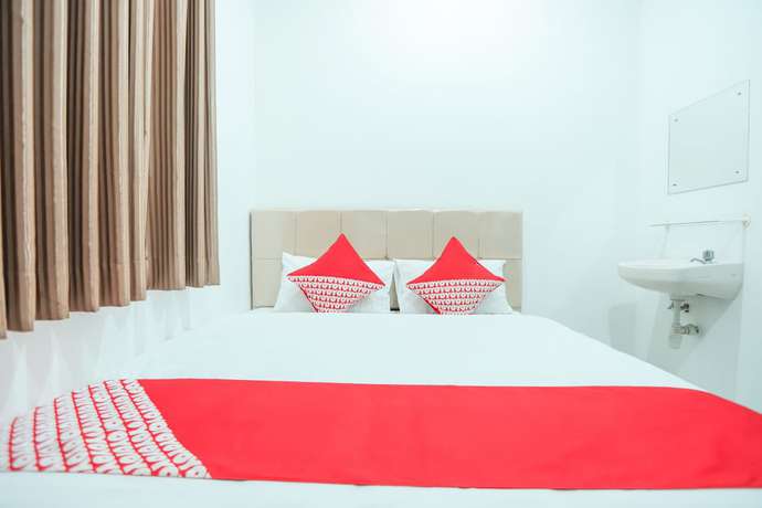 Imagen de la habitación del Hotel OYO 150 Harmoni Residence. Foto 11