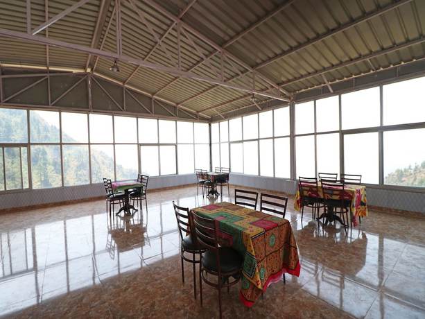 Imagen del bar/restaurante del Hotel OYO 15022 Snow Point Inn. Foto 4