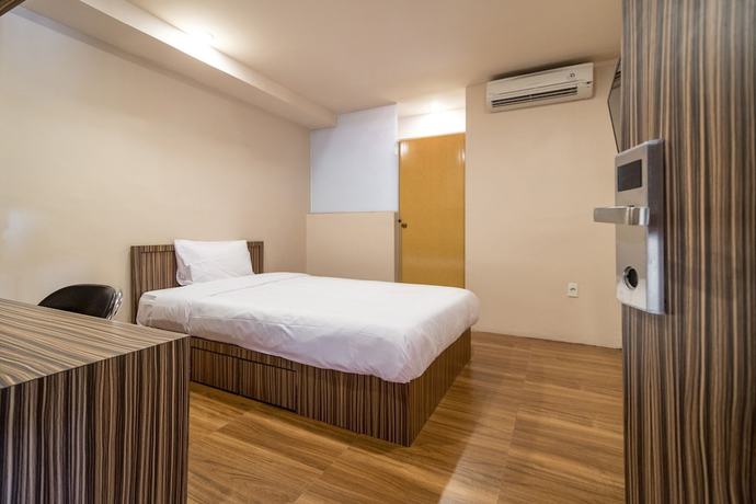 Imagen de la habitación del Hotel OYO 1512 Harley. Foto 13